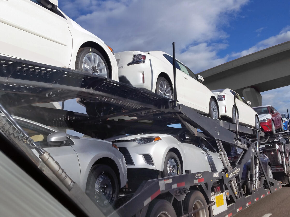Toyota vehicles loaded on open auto carrier for transport